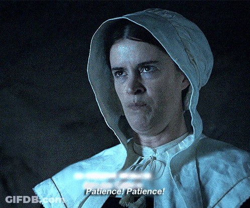 A Woman In A Hooded Cape Says Patience GIF