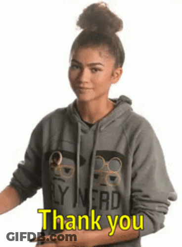 A Woman In A Hoodie Is Giving A Thumbs Up And Saying `` Thank You '' . GIF