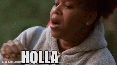 A Woman In A Hoodie Is Making A Funny Face And The Word Holla Is On Her Face . GIF
