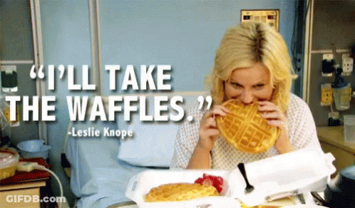 A Woman In A Hospital Bed Eating A Waffle With A Quote From Leslie Knope GIF