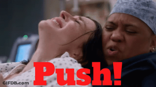 A Woman In A Hospital Bed With The Word Push On The Bottom GIF