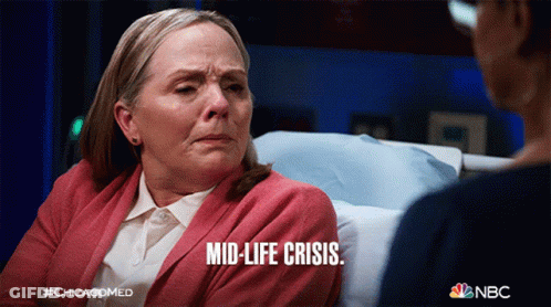A Woman In A Hospital Bed With The Words Mid-Life Crisis Written On Her Face GIF