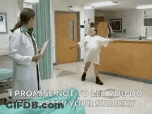 A Woman In A Hospital Gown Is Dancing In Front Of A Doctor Who Is Holding A Clipboard . GIF