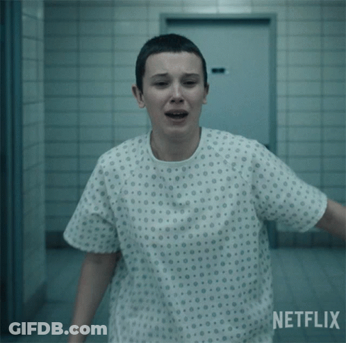 A Woman In A Hospital Gown With A Netflix Logo Behind Her GIF