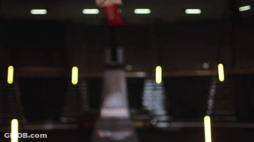 A Woman In A Iowa Jersey Looks At The Camera GIF