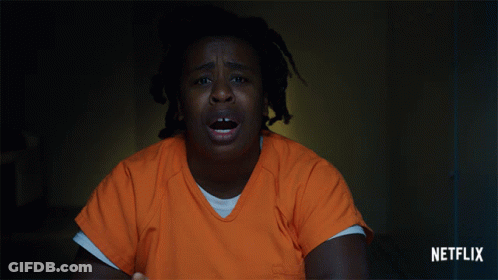 A Woman In A Jail Cell With Netflix Written On The Bottom GIF