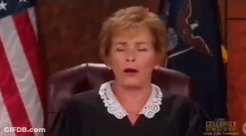 A Woman In A Judge 'S Chair With Her Eyes Closed GIF