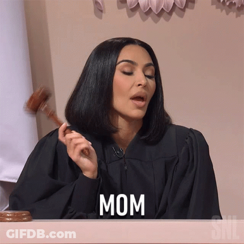 A Woman In A Judge 'S Robe Is Holding A Gavel And The Word Mom Is On The Screen GIF