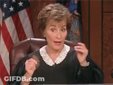 Judge Sitting Behind American Flag GIF