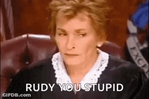 A Woman In A Judge 'S Robe Is Sitting In A Courtroom . GIF