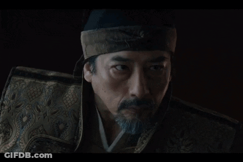 A Woman In A Kimono Kneels In Front Of A Man GIF