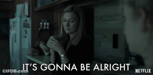 A Woman In A Kitchen Holding A Cup With The Words It 'S Gonna Be Alright On The Bottom GIF