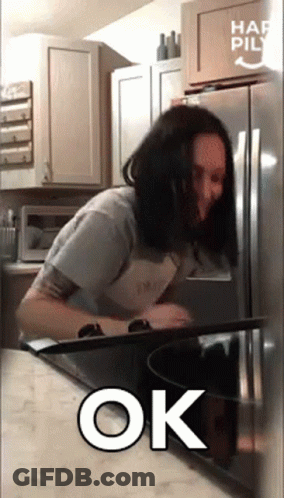 Woman In Kitchen With Ok Sign GIF