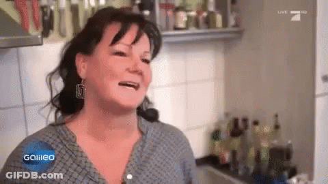 A Woman In A Kitchen With The Word Galileo On The Screen GIF