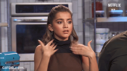 A Woman In A Kitchen With The Word Netflix On The Bottom GIF