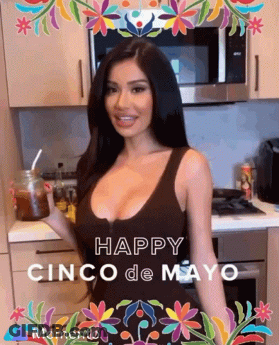 A Woman In A Kitchen With The Words Happy Cinco De Mayo Momento On The Bottom GIF