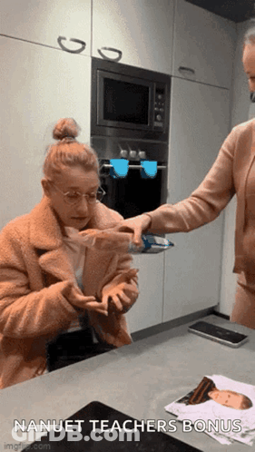 A Woman In A Kitchen With The Words Nanuet Teachers Bonus GIF