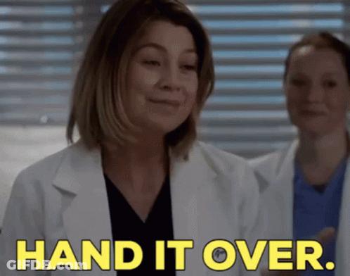 A Woman In A Lab Coat Is Saying " Hand It Over " GIF