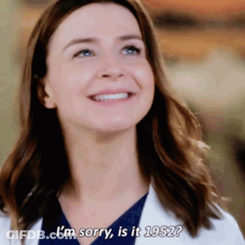 A Woman In A Lab Coat Is Smiling And Says " I 'M Sorry Is It 1952 " GIF