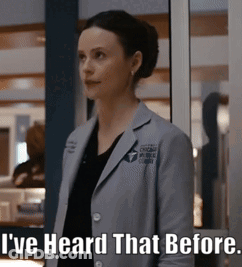 A Woman In A Lab Coat Is Standing In Front Of A Window And Says " I 'Ve Heard That Before " GIF