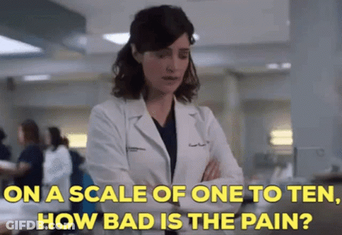 A Woman In A Lab Coat Is Talking About How Bad The Pain Is GIF