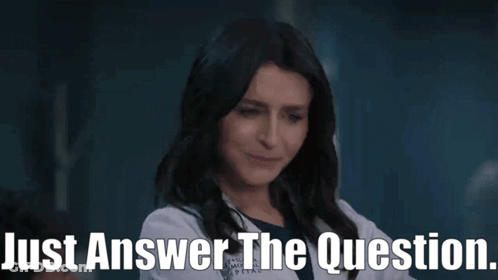 A Woman In A Lab Coat Is Talking To Someone And Says Just Answer The Question . GIF