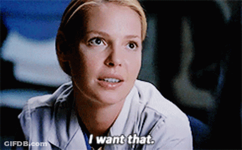 A Woman In A Lab Coat Says " I Want That " In A Close Up GIF
