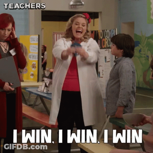 A Woman In A Lab Coat Says " I Win I Win I Win " In A Classroom GIF