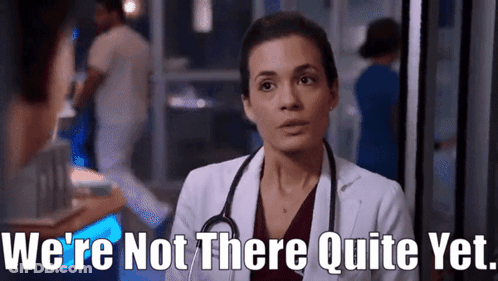 A Woman In A Lab Coat With A Stethoscope Around Her Neck Says We 'Re Not There Quite Yet GIF