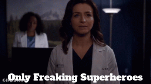 A Woman In A Lab Coat With The Words Only Freaking Superheroes Above Her GIF