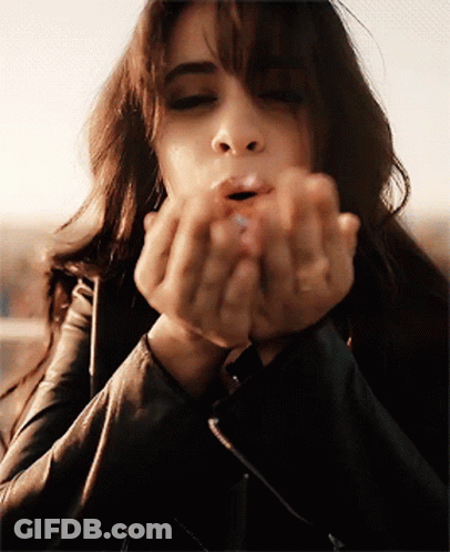 Woman Blowing Kiss With Hands GIF