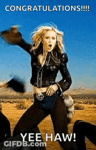 A Woman In A Leather Jacket Is Dancing In The Desert With The Words Yee Haw Below Her GIF