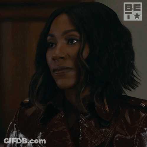 A Woman In A Leather Jacket Is Laughing With The Words Ha Ha Written Below Her GIF