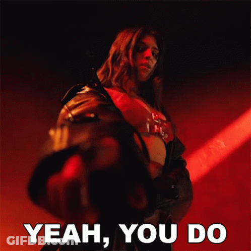 Woman In Leather Jacket Pointing With Yeah You Do Text GIF