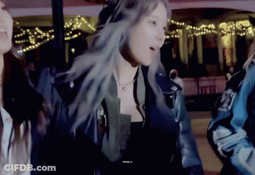 A Woman In A Leather Jacket Is Standing Next To Another Woman In A Blue Jacket GIF