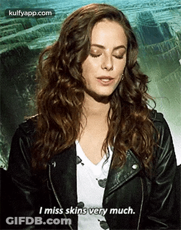A Woman In A Leather Jacket Is Talking About Missing Skins Very Much . GIF