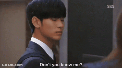 A Woman In A Leather Jacket Is Talking To A Man In A Suit And Says " Don 'T You Know Me " GIF