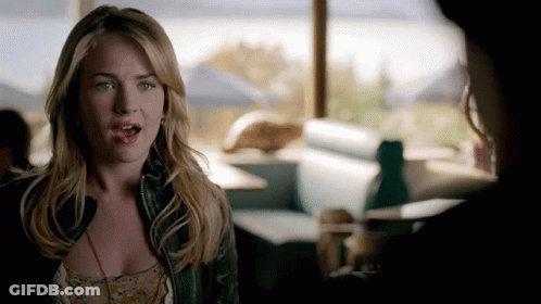 Woman In Diner Talking To Another Woman GIF