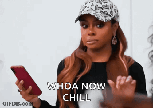A Woman In A Leopard Print Hat Is Holding A Cell Phone And Says Whoa Now Chill GIF