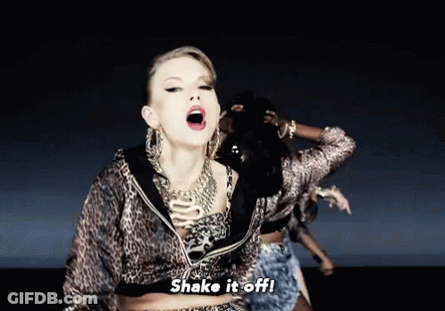A Woman In A Leopard Print Jacket Says Shake It Off In A Video GIF