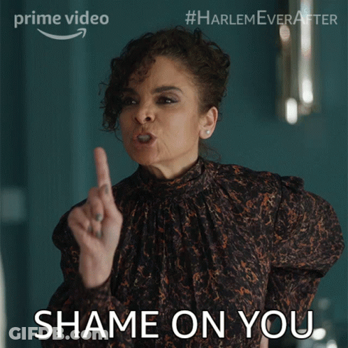 A Woman In A Leopard Print Top Is Pointing Her Finger At Someone And Says " Shame On You " GIF