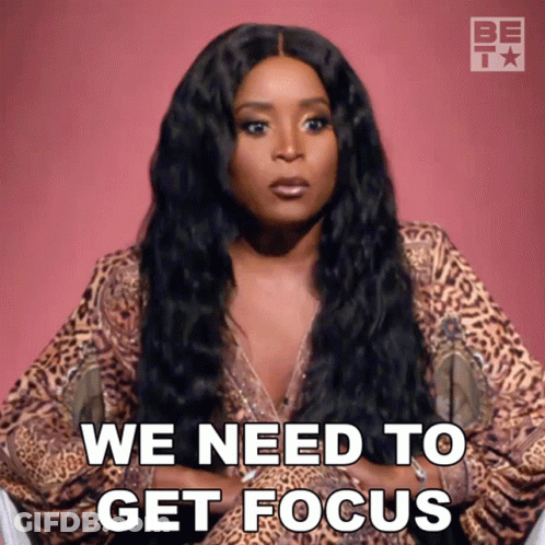 A Woman In A Leopard Print Top Says We Need To Get Focus GIF