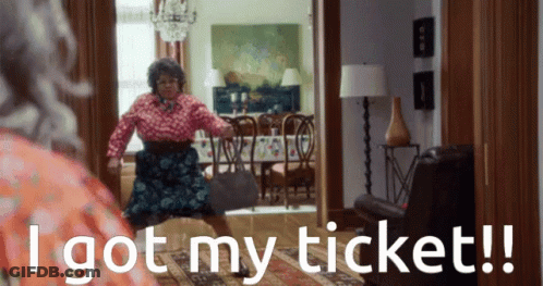 A Woman In A Living Room With The Words I Got My Ticket Below Her GIF