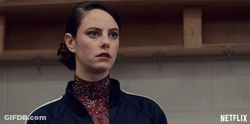 A Woman In A Locker Room With Netflix Written On The Bottom GIF