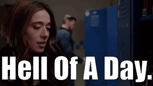 A Woman In A Locker Room With The Words Hell Of A Day Behind Her GIF