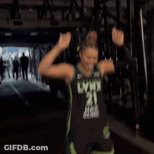 A Woman In A Lynx Jersey Is Dancing In A Tunnel GIF