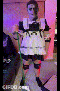 A Woman In A Maid Costume Is Holding A Mop GIF