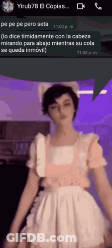 A Woman In A Maid Costume Is Talking On A Cell Phone GIF