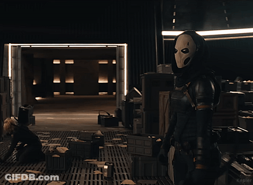 Woman In Mask Standing In Dark Room Kepler GIF