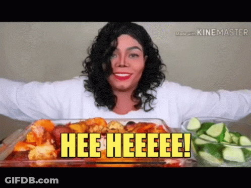 A Woman In A Michael Jackson Costume Is Eating A Casserole Dish Of Food With The Words Hee Heeeee On It GIF
